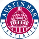 Logo of the Austin Bar Association featuring a drawing of a domed building, surrounded by blue and red text.